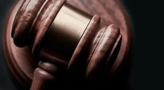 gavel in court in a black background